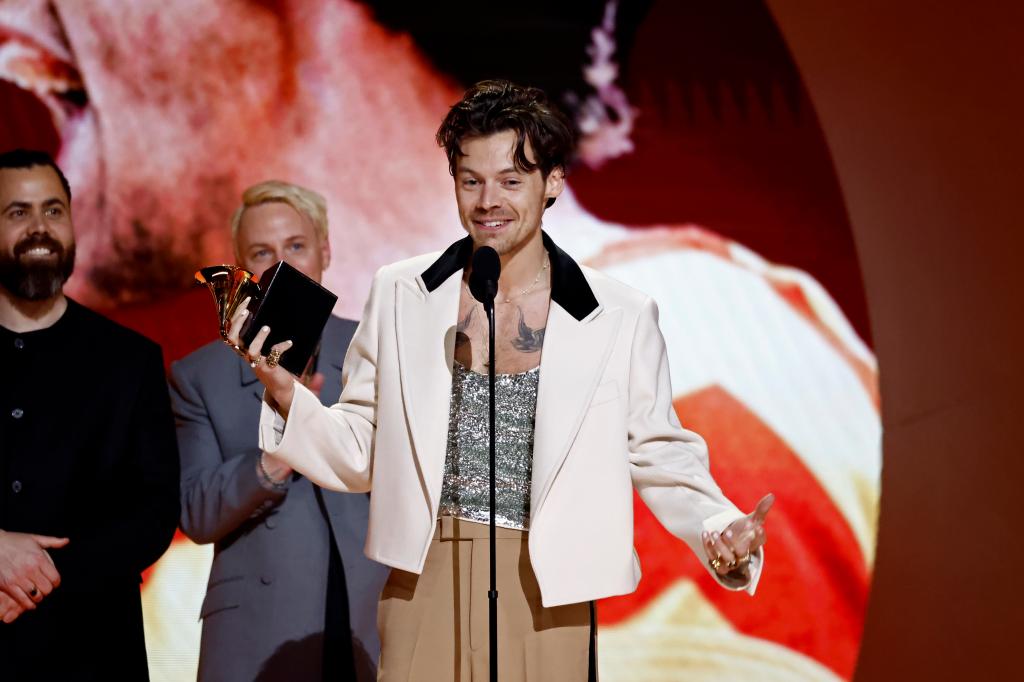 LOS ANGELES, CALIFORNIA - FEBRUARY 05: L-R) Kid Harpoon and Harry Styles accept the Album Of The Year award for âHarry's Houseâ onstage during the 65th GRAMMY Awards at Crypto.com Arena on February 05, 2023 in Los Angeles, California. (Photo by Emma McIntyre/Getty Images for The Recording Academy)