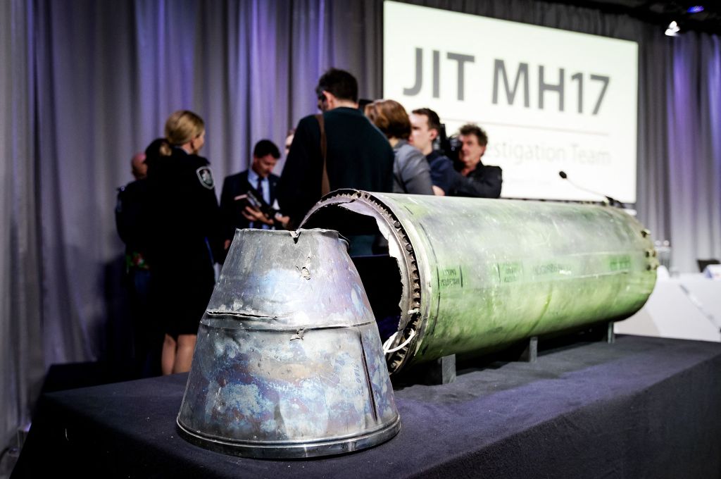 A part of the BUK-TELAR rocket that was fired on the MH17 flight is displayed on a table during the persconference of the Joint Investigation Team (JIT), in Bunnik on May 24, 2018. 