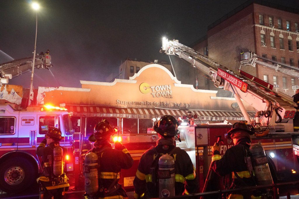 Firefighters battling a five-alarm fire at a C-Town Supermarket located at 1750 University Avenue in the Bronx.