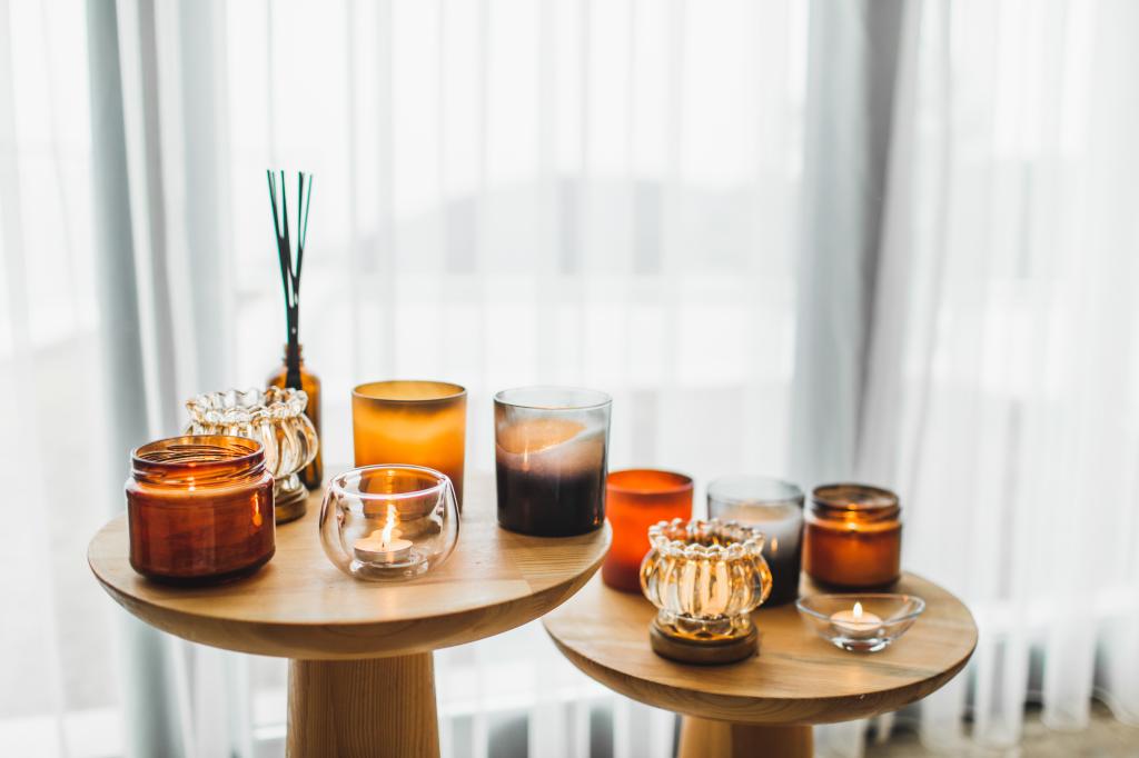 array of candles on tables next to window