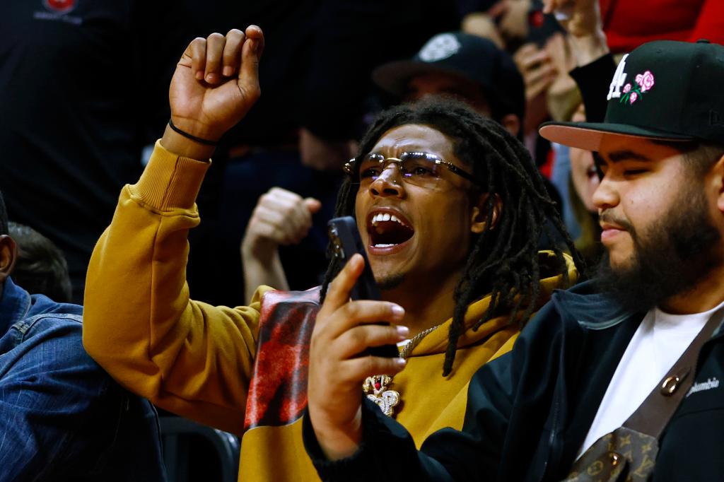 Running back Isiah Pacheco of the Kansas City Chiefs cheers his alma mater the Rutgers Scarlet Knights during the second half of a game against the Michigan Wolverines.