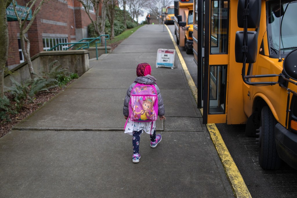 A student leaves the Thurgood Marshal Elementary school after the Seattle Public School system was abruptly closed due to coronavirus fears on March 11, 2020 in Seattle, Washington. Schools will be closed for a minimum of two weeks. 