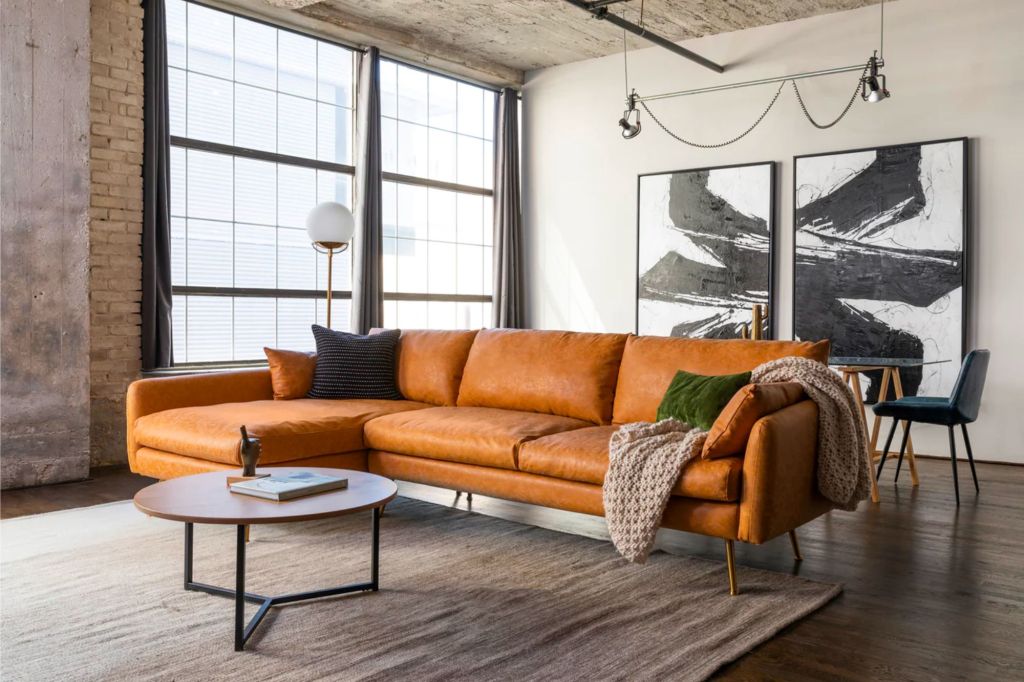 A leather sectional with a coffee table.