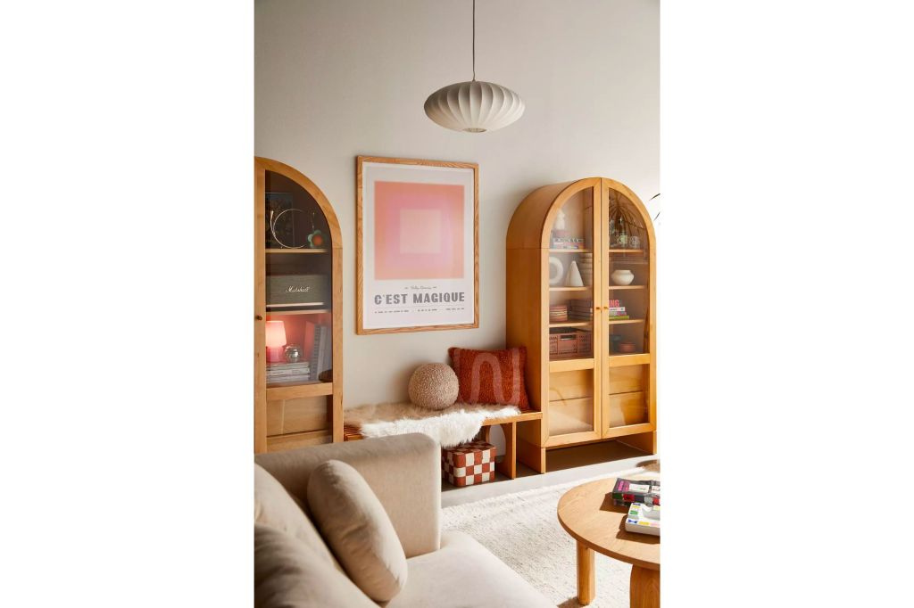 A living room with a vintage style cabinet.