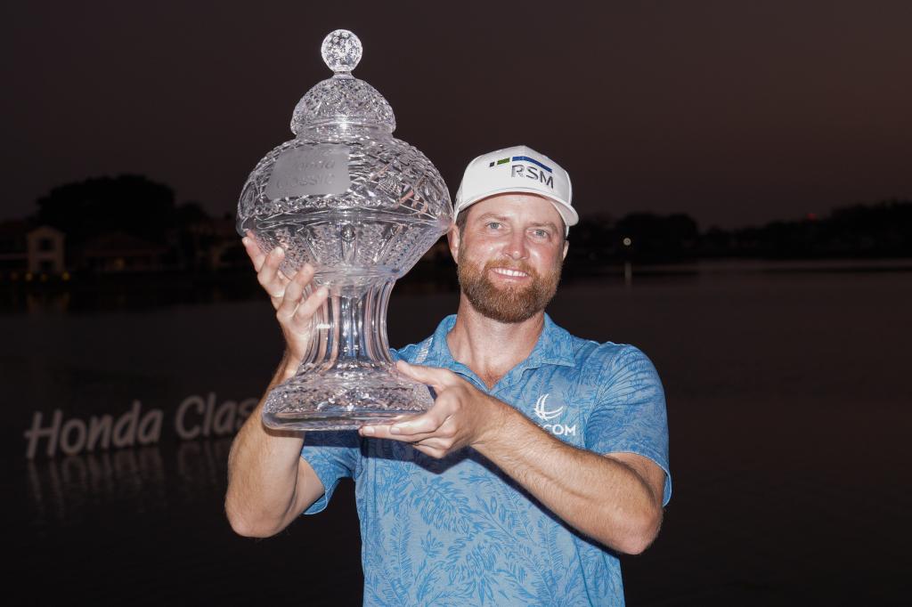 Chris Kirk holds the trophy after winning the Honda Classic.