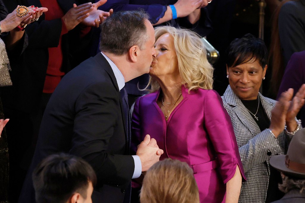 First Lady Jill Biden and Second Gentlemen Doug Emhoff kiss prior to President Biden's State of the Union.