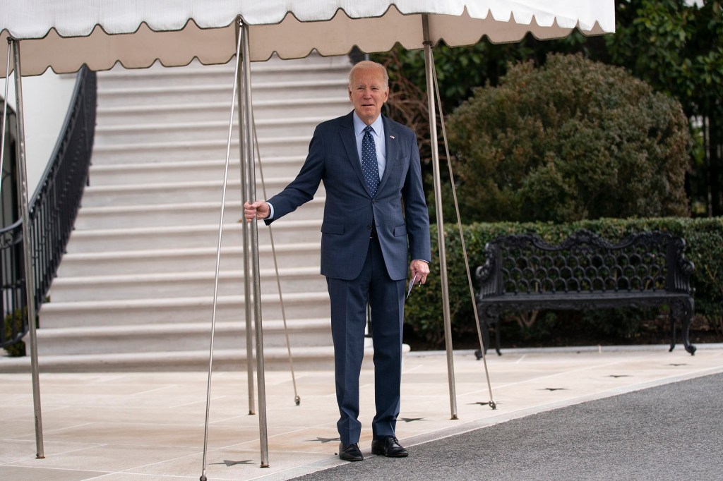 President Joe Biden listens to a question from reporters as he walks to board Marine One on the South Lawn.