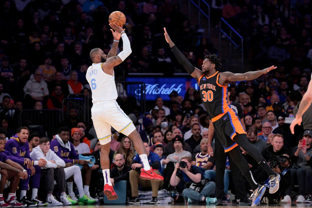 LeBron James #6 of the Los Angeles Lakers puts up a shot over Julius Randle #30 of the New York Knicks during the third quarter. The Los Angeles Lakers defeated the New York Knicks 129-123.