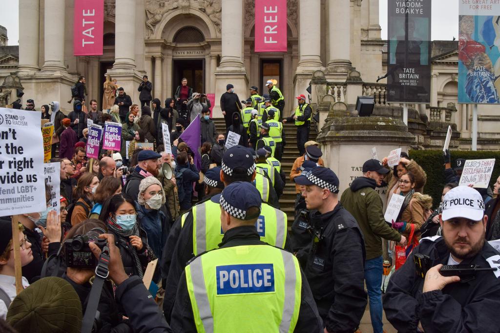 Riot police move in to separate two groups of protesters during the demonstration in London on Feb. 11, 2023.