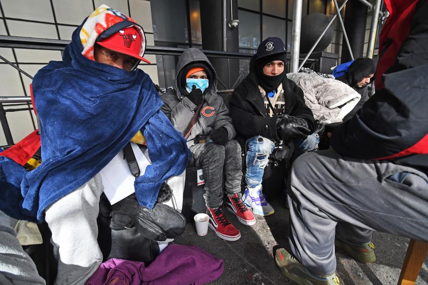 A group of migrants outside the Watson Hotel.