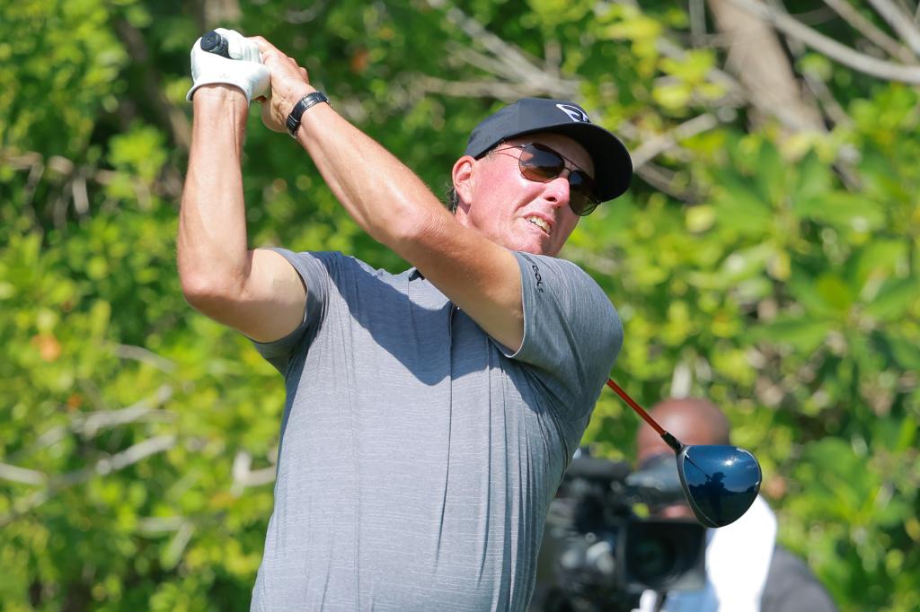 Phil Mickelson hits a shot during LIV Golf's season-opener at Mayakoba.