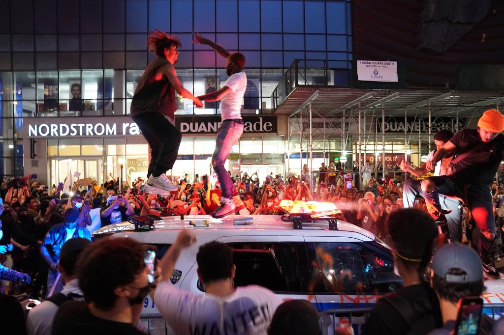 Protestors danced on top of a NYPD car on May 30 during a protest for George Floyd.