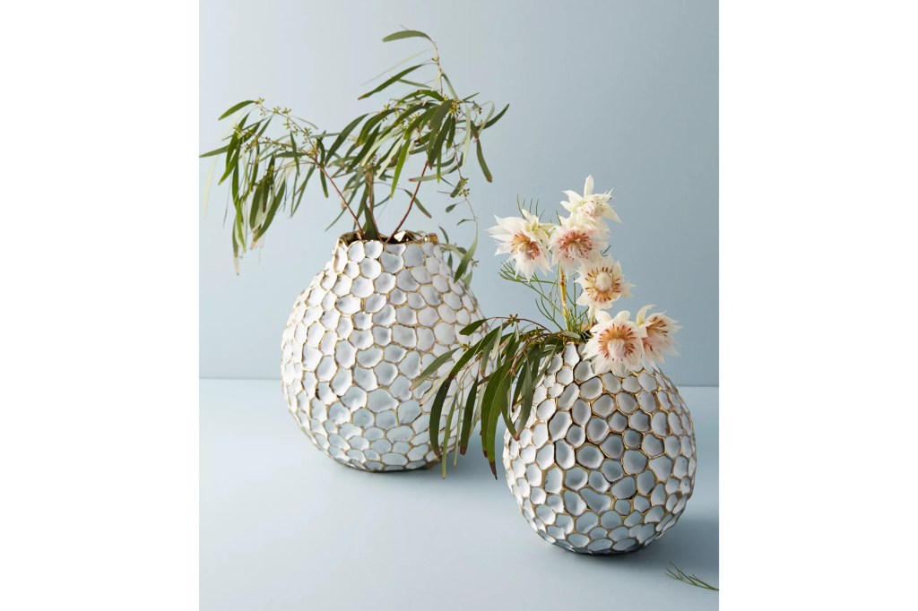 Two white honeycomb vases