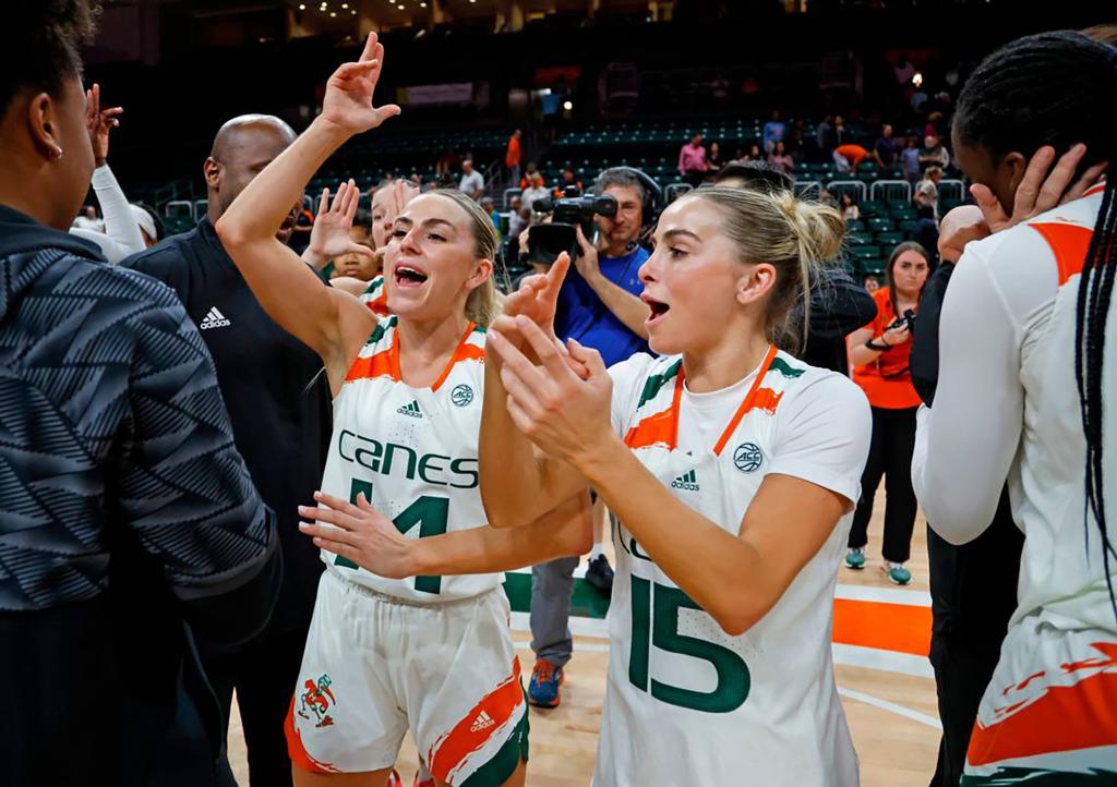 Haley Cavinder (14) and Hanna Cavinder (15) celebrate after the Miami Hurricanes defeated Florida State at the Watsco Center on Feb. 9, 2023, in Coral Gables, Florida.