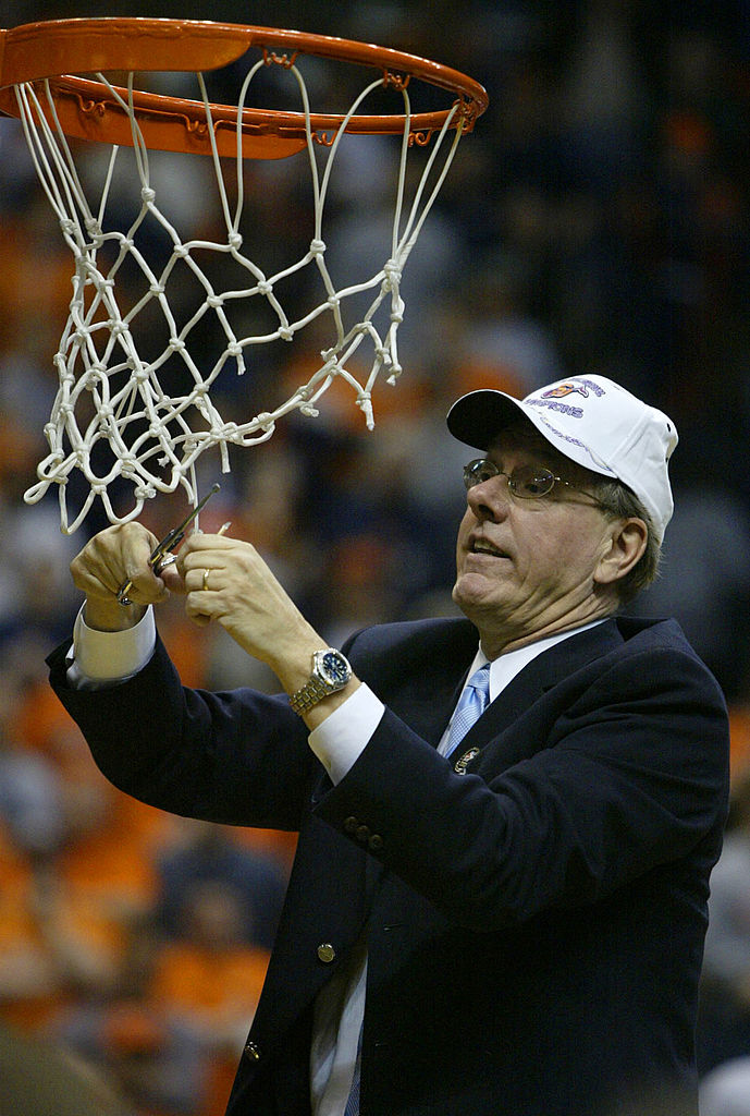 Jim Boeheim cuts down net after winning 2003 national title at Syracuse.