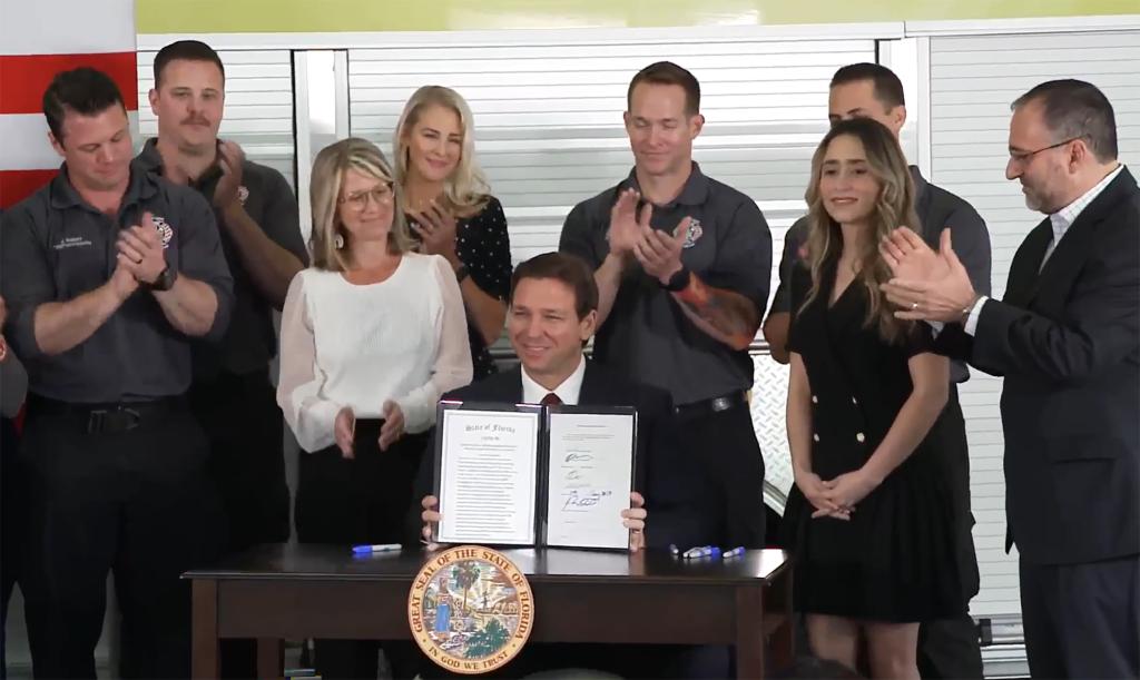 Florida Gov. Ron DeSantis signs legislation to end Disney's self-governing status Monday, Feb. 27, 2023.