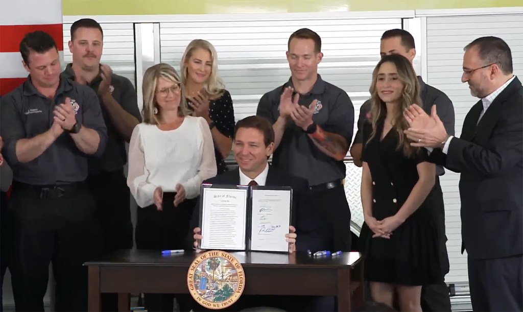 Florida Gov. Ron DeSantis signs legislation to end Disney's self-governing status Monday, Feb. 27, 2023.