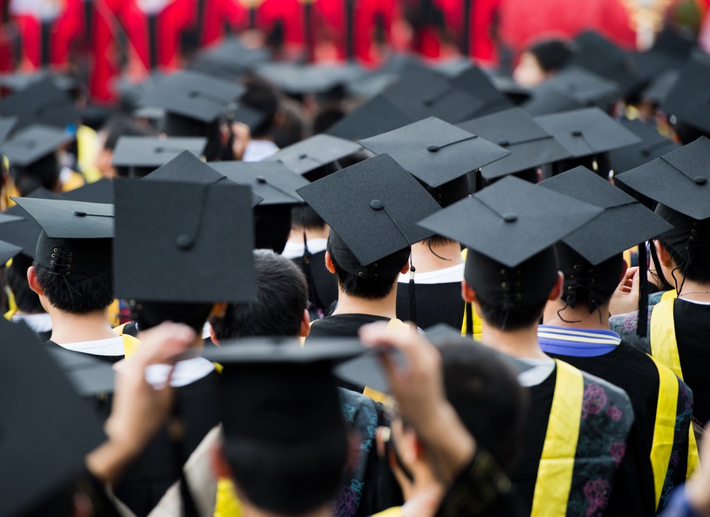 back of graduates during commencement.