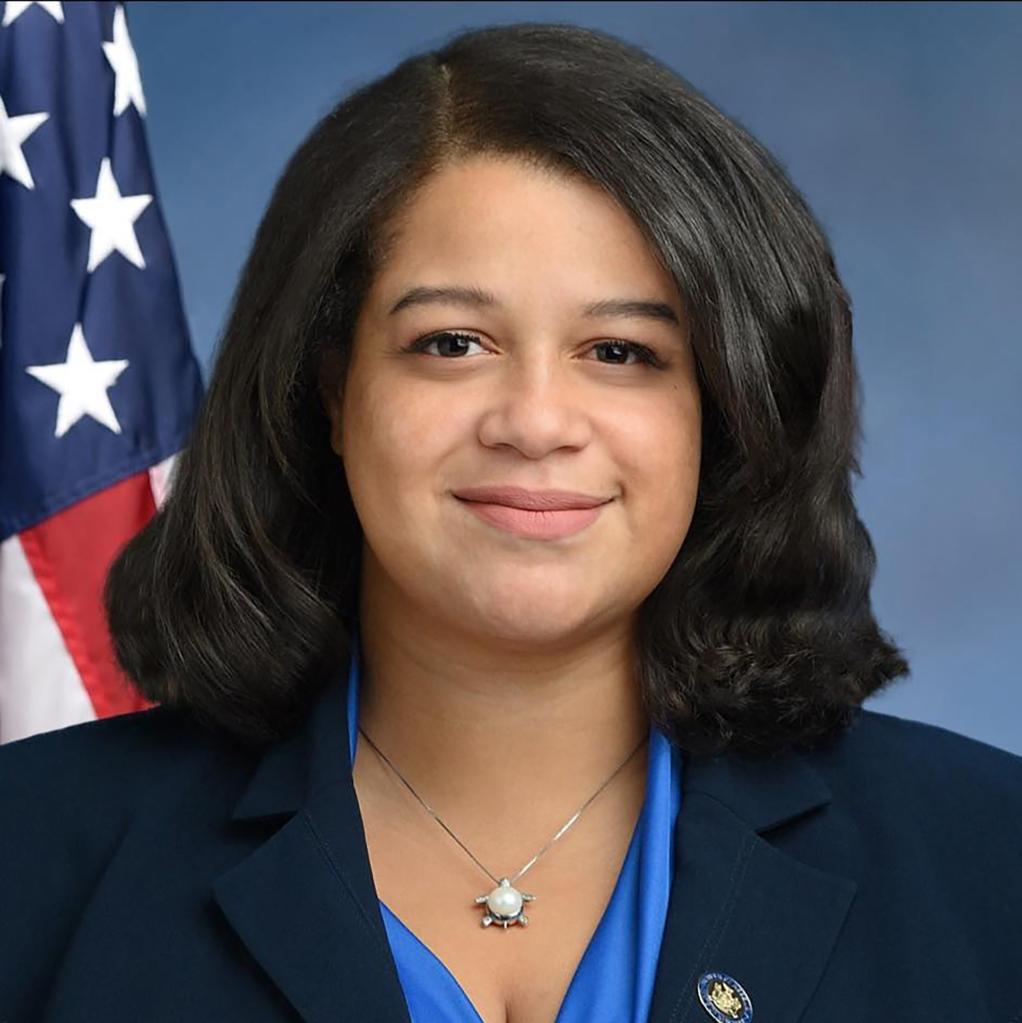 Michaelle Solages in a headshot with a blurry background