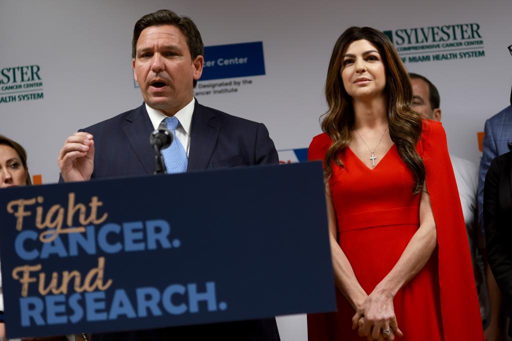 Florida Gov. Ron DeSantis, alongside his wife, speaks during a press conference at the University of Miami Health System Don Soffer Clinical Research Center on May 17, 2022.