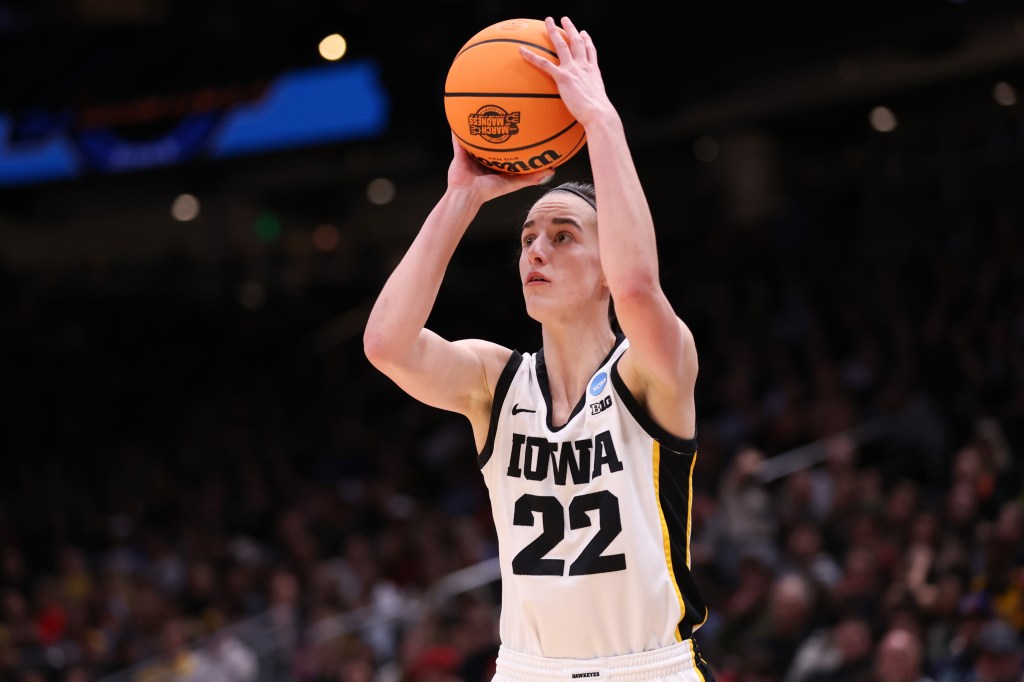 Caitlin Clark shoots the ball against the Louisville Cardinals during the third quarter in the Elite Eight round.