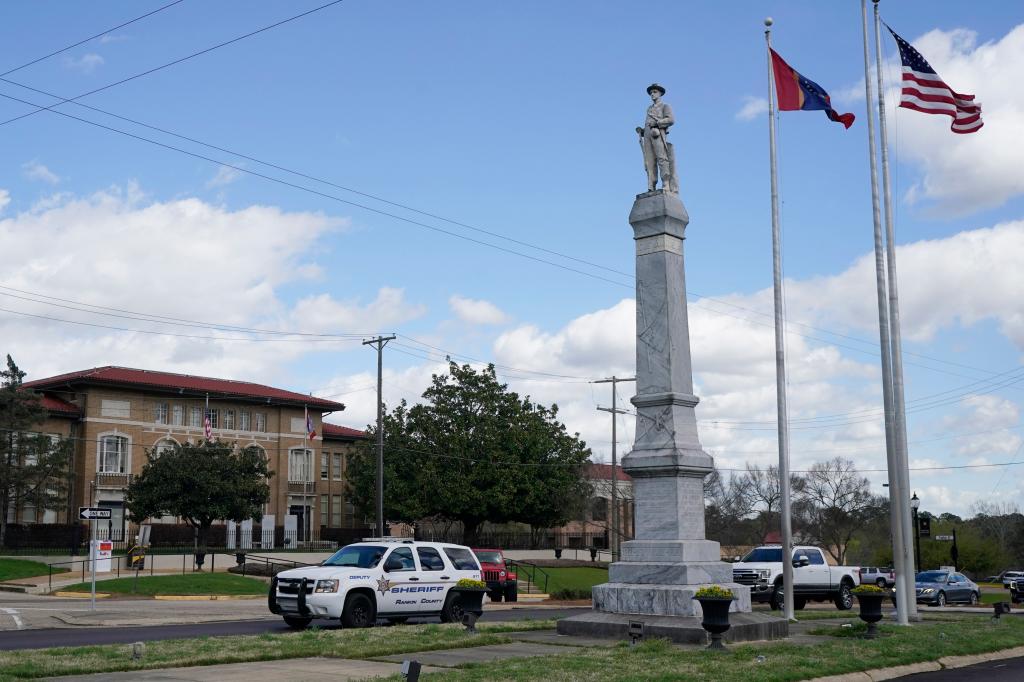 A Rankin County Sheriff's Deputy SUV drives past the Rankin County Confederate Monument in Brandon, Miss., Friday, March 3, 2023.