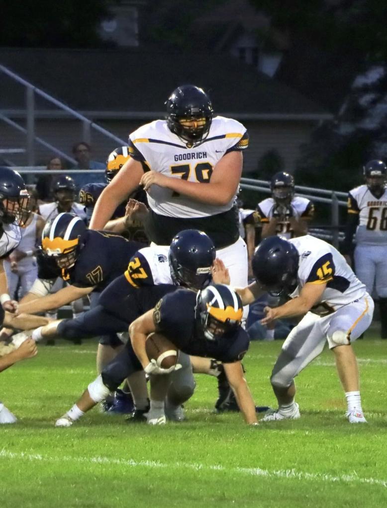 Eric Kilburn, a 6-foot-10 high school freshman, playing football for Goodrich High School in Michigan.