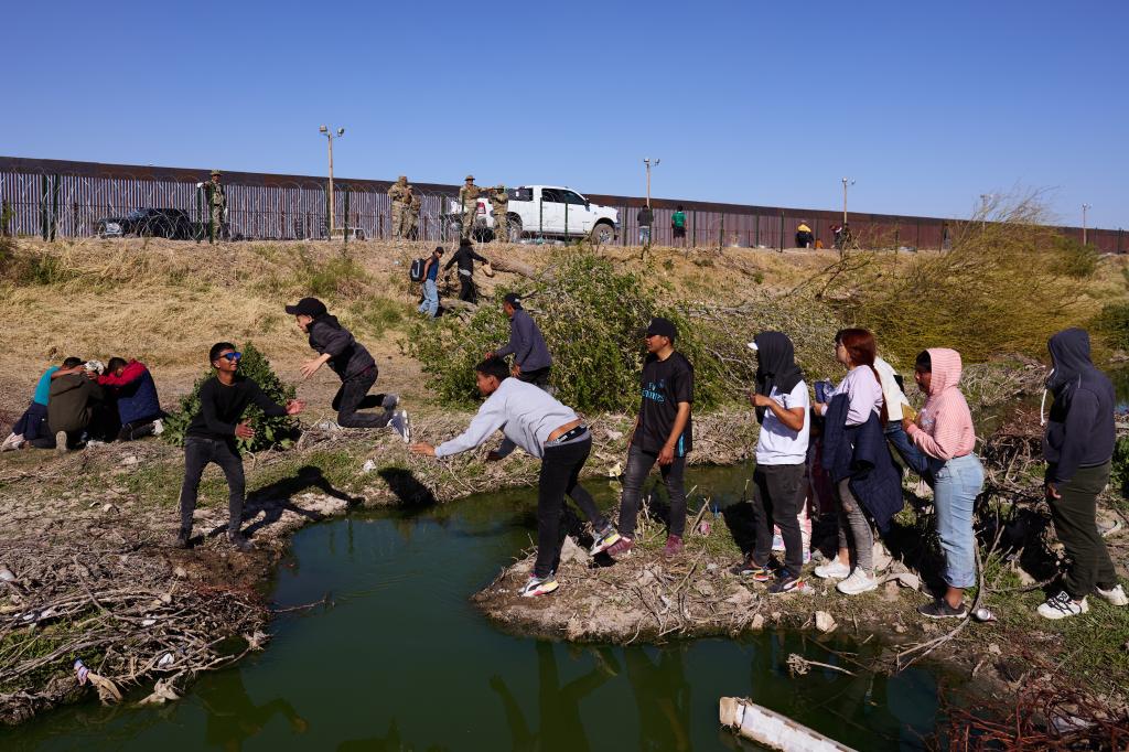 The frantic race to toss children over the border started due to a false rumor on social media.