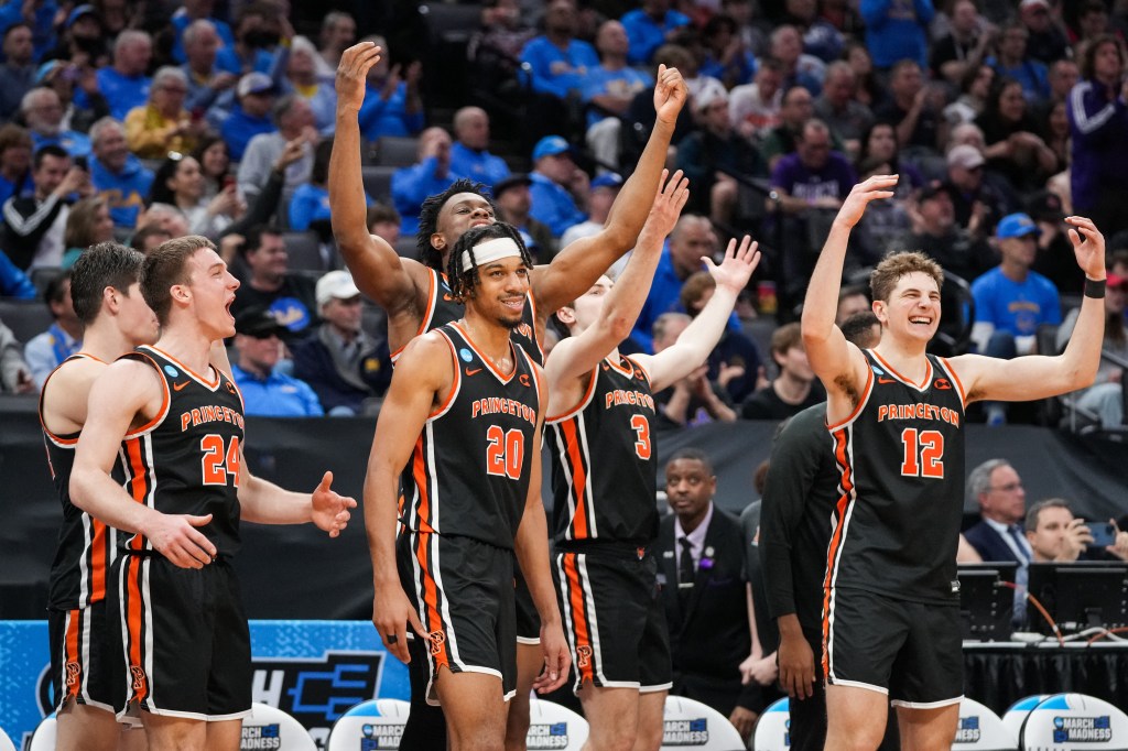 Princeton players celebrate during their 78-63 upset win over Missouri during the second round of the NCAA Tournament.