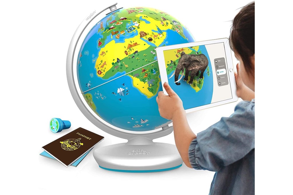 Kid playing with globe of the world