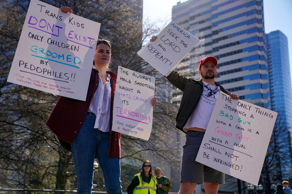 Supporters of the Tennessee bill hold up signs outside the Tennessee State Capitol two days before the bill was set to go in effect.