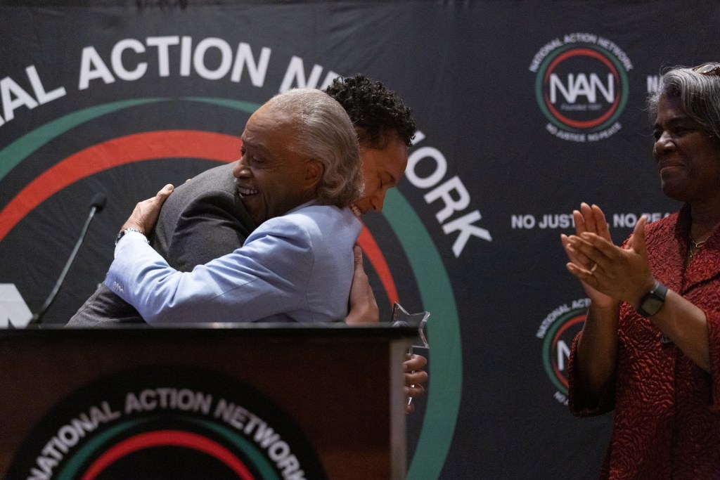 Rev. Al Sharpton embraces Brittney Griner