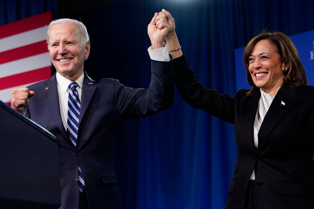 President Joe Biden and Vice President Kamala Harris stand on stage at the Democratic National Committee winter meeting, on Feb. 3, 2023, in Philadelphia.