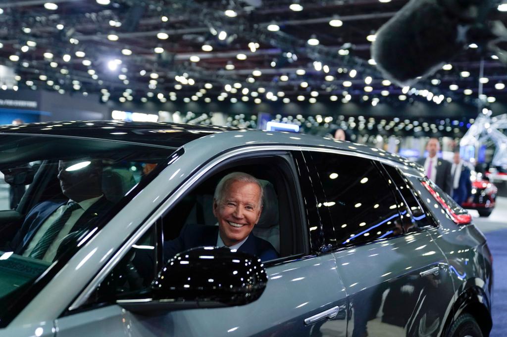 President Biden behind the wheel of a battery-powered Cadillac Lyriq at the Detroit Auto Show on Sept. 14, 2022.