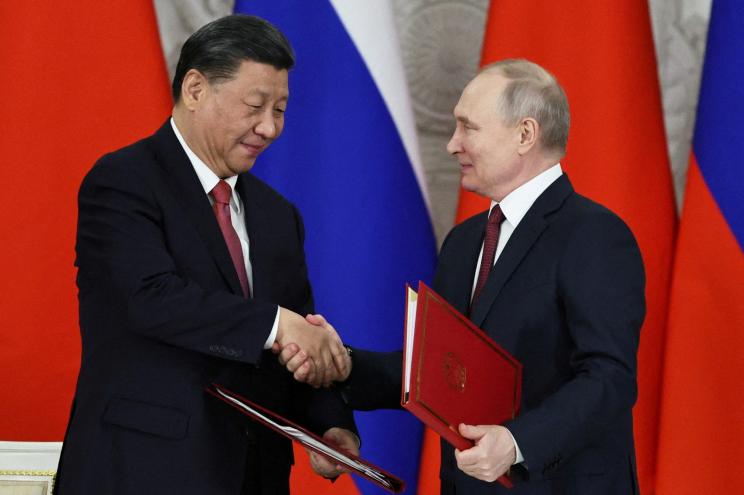 Russian President Vladimir Putin and Chinese President Xi Jinping at a ceremony following their talks in Moscow on March 21, 2023.