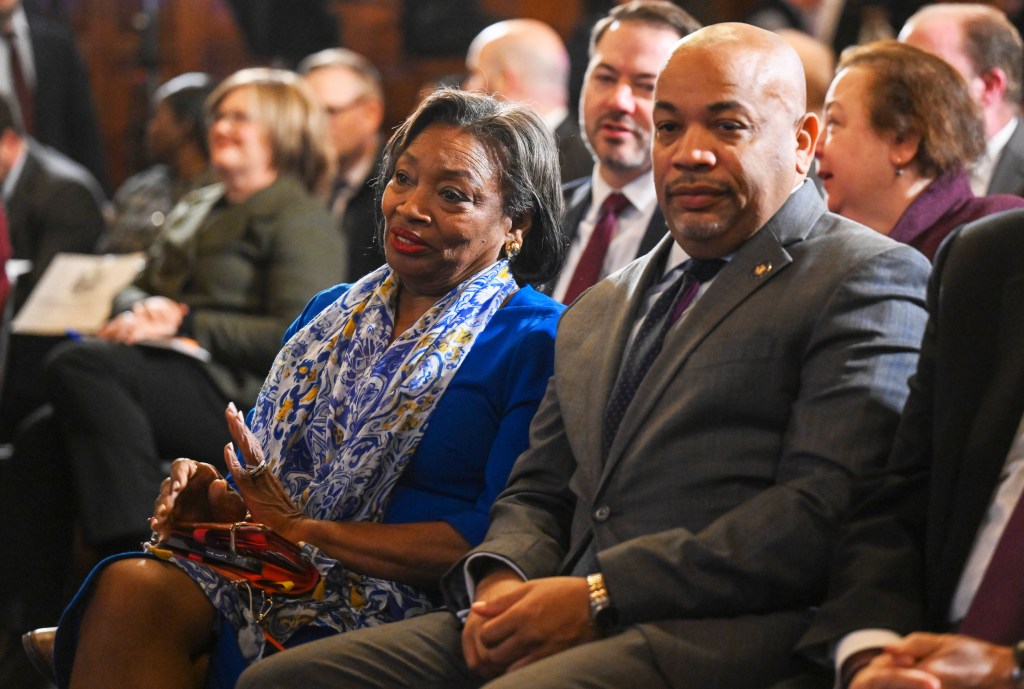 Andrea Stewart-Cousins and Carl Heastie sitting in a crowd