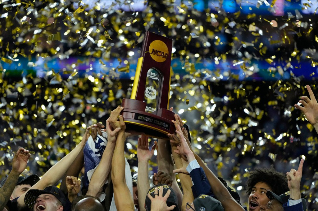 Connecticut Huskies players celebrate after defeating the San Diego State Aztecs in the national championship game