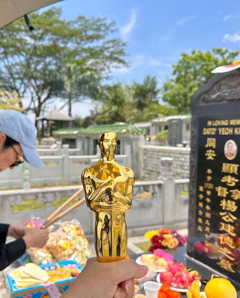 "Brought Mr.O home," Yeoh wrote beneath a photo that showed her holding up her Oscar at the graveyard. 