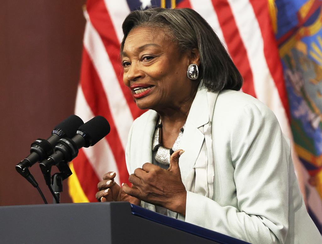 Andrea Stewart-Cousins speaking at a podium with a microphone