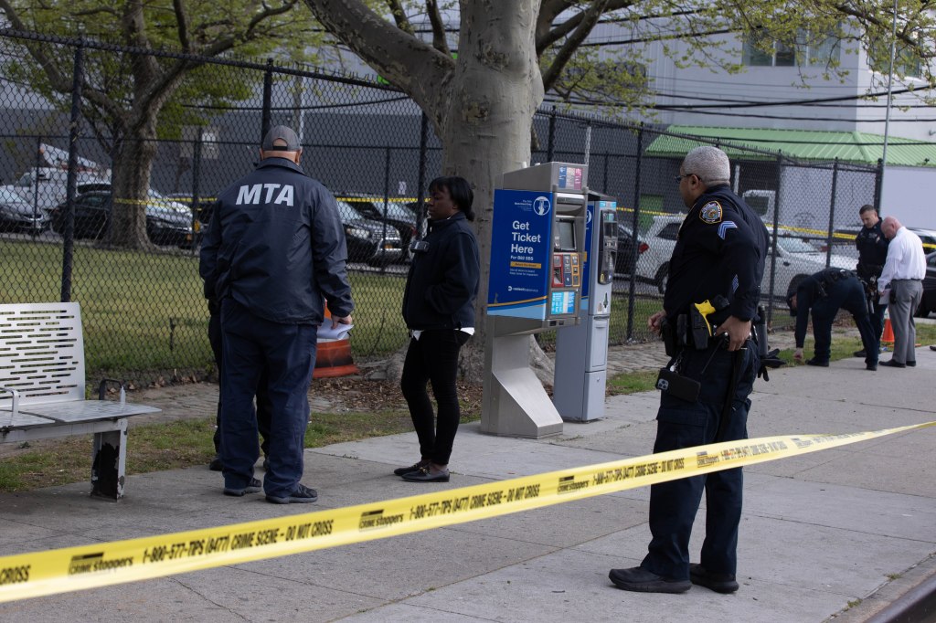 Police respond to the scene where a gunman fired at three MTA inspectors at Flatlands Ave. and Louisiana Ave.