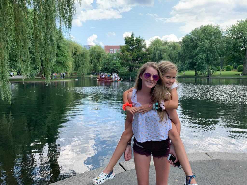 Sydney West posing with her younger sister.