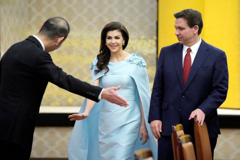 Casey DeSantis stunned in a powder-blue evening gown featuring a dramatic cape and bedazzled epaulets. 