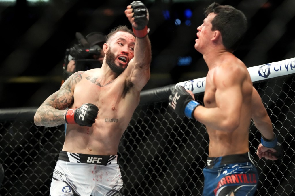 Shane Burgos (left) in his fight against Billy Quarantillo at UFC 268.