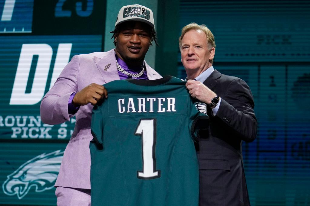 Georgia defensive lineman Jalen Carter poses with NFL Commissioner Roger Goodell after being drafted by the Eagles.