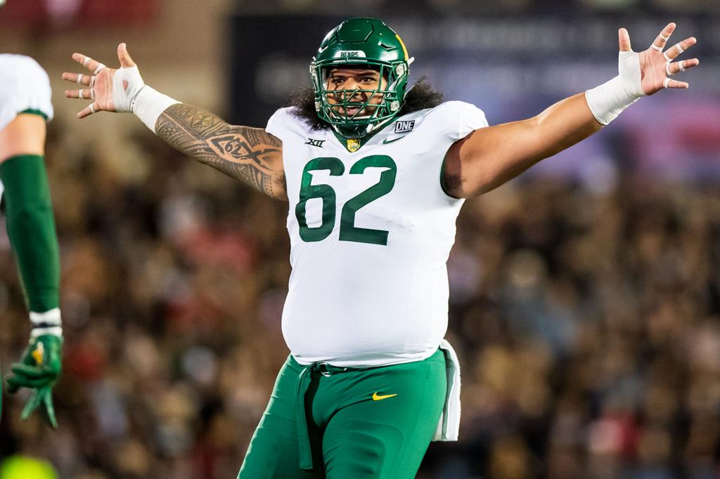 Defensive lineman Siaki Ika #62 of the Baylor Bears reacts during the first half of the game against the Texas Tech Red Raiders at Jones AT&T Stadium on October 29, 2022 in Lubbock, Texas.