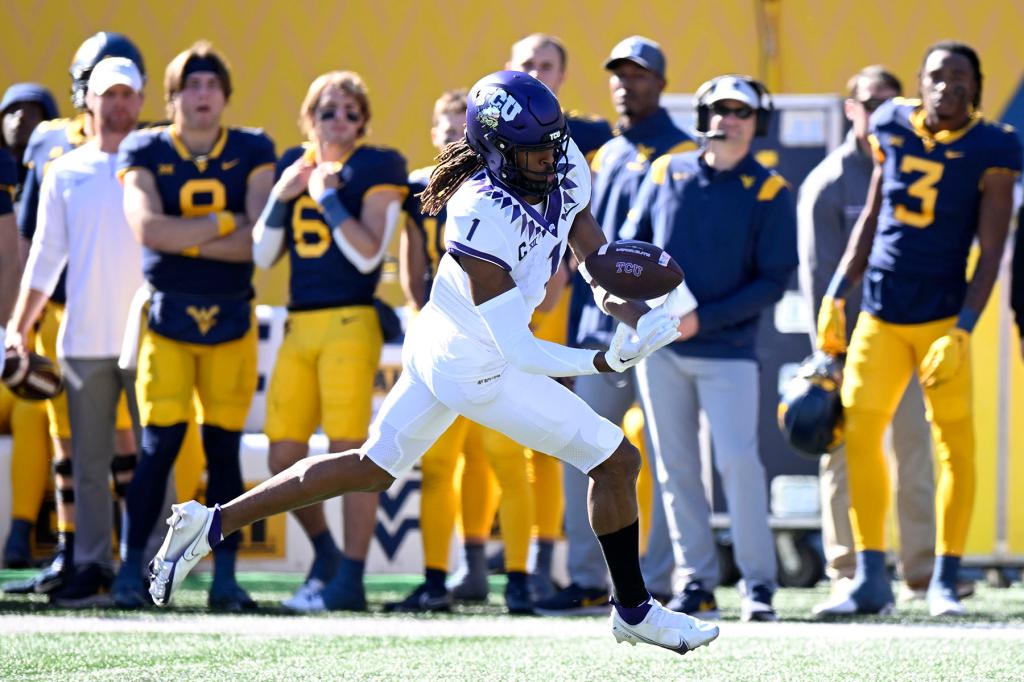 Quentin Johnston #1 of the TCU Horned Frogs catches a pass for a touchdown against the West Virginia Mountaineers at Mountaineer Field on October 29, 2022 in Morgantown, West Virginia.