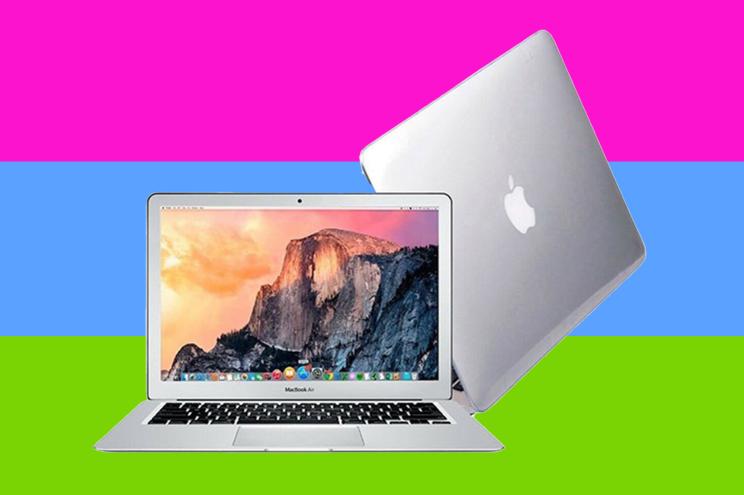 A chrome MacBook Air on a pink, blue, and green striped background.