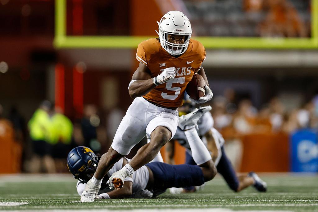 Bijan Robinson #5 of the Texas Longhorns runs the ball in the fourth quarter against the West Virginia Mountaineers at Darrell K Royal-Texas Memorial Stadium on October 01, 2022 in Austin, Texas.