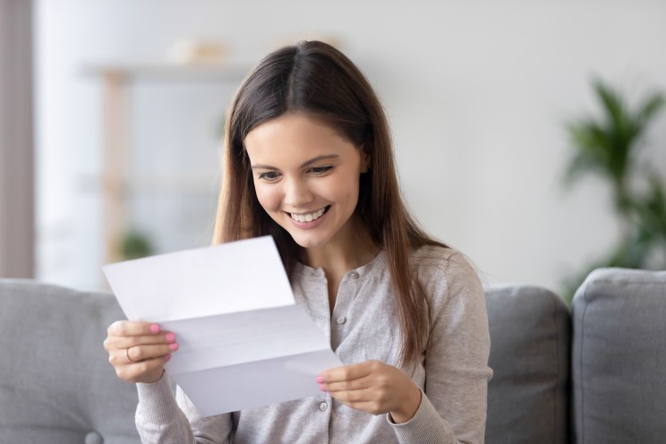 Student smiles after being approved for a loan