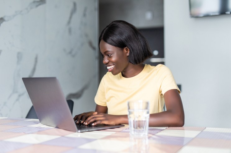 Student smiles as she is approved for a loan without a cosigner